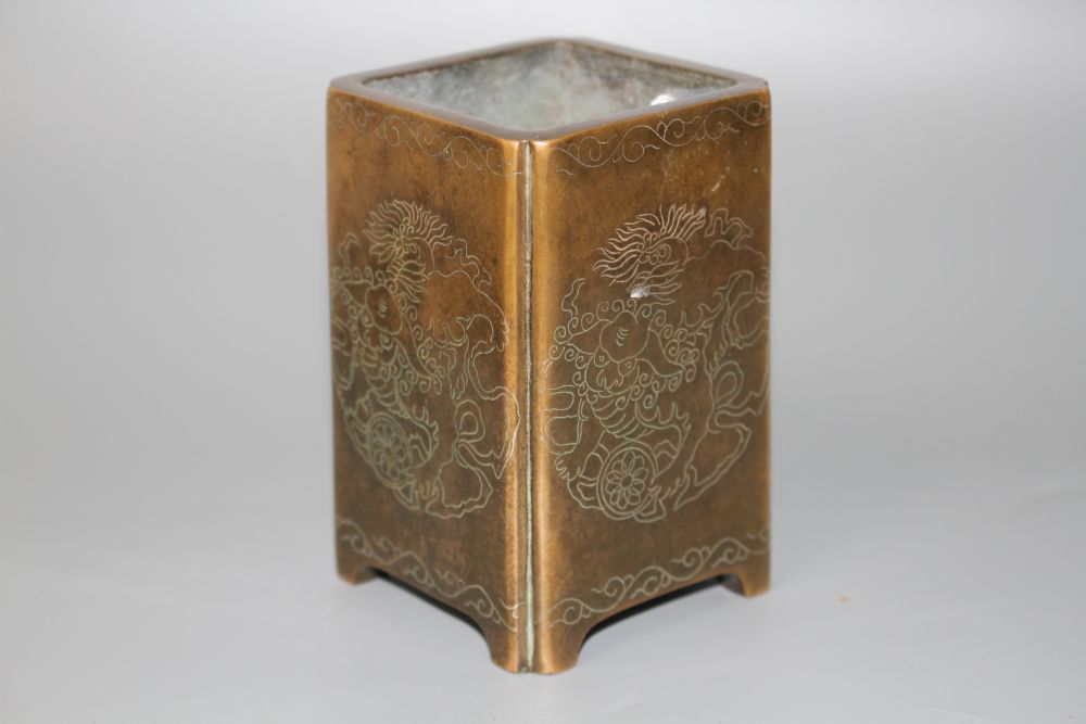 A Chinese bronze and silver inlaid square brush pot, H.10cm